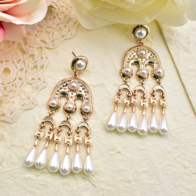 This timeless arch motif has a three-sided shape framed by pearls, and three small arches with pearl drops hanging down the center like teardrops. Greek-chic and Bohemian, this pair of earrings is perfect for day or night.